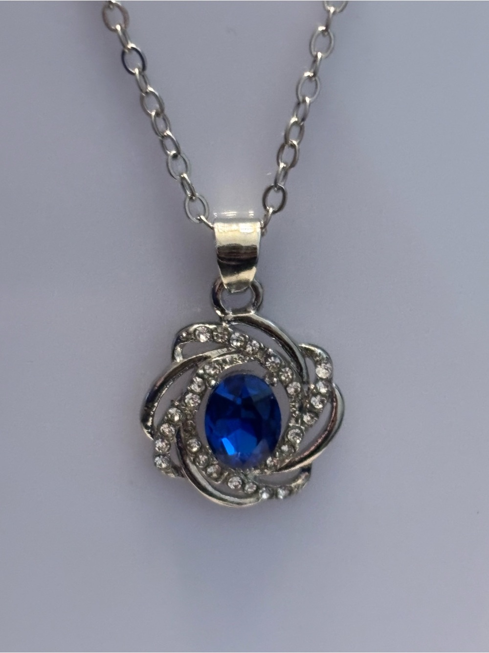 Silver Tone Swirl Pendant Necklace, Faceted Blue Oval Stone, Clear Rhinestones,